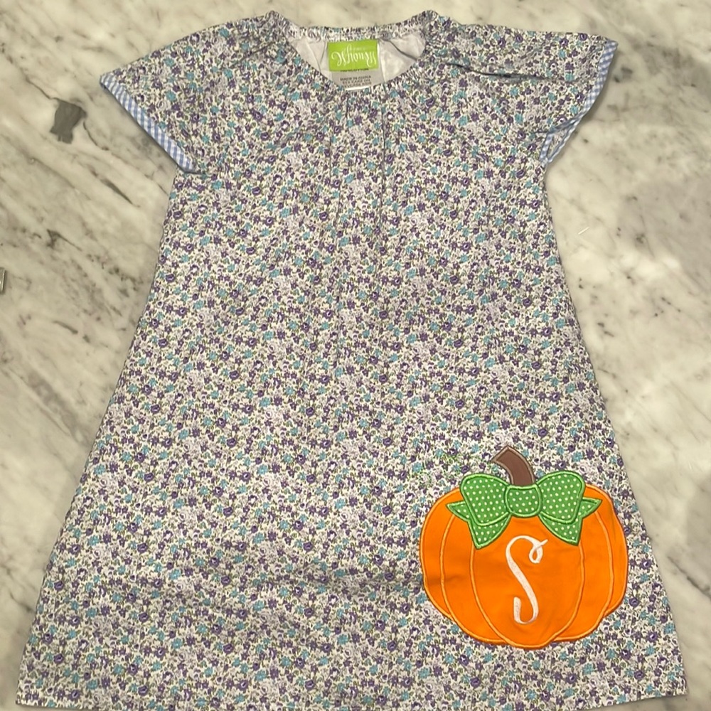 Girls 3T floral dress with pumpkin on the bottom left with a monogrammed “S”.